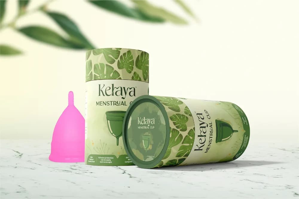 Kelava — Packaging for a menstrual cup brand, using a botanical surface pattern across tube and carton formats.